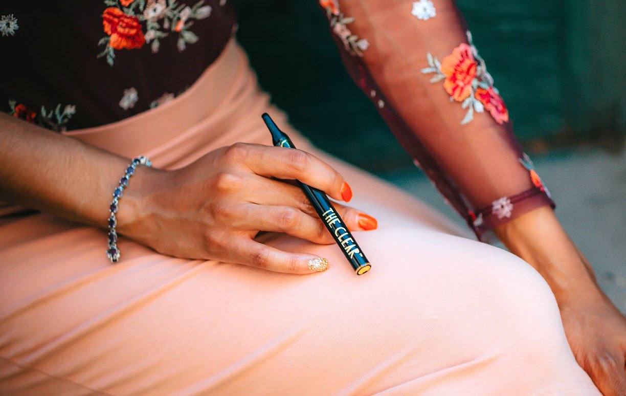 Woman Holding E-Cigarette Woman Holding E-Cigarette